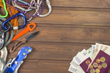 Equipment for adventure. Travel needs on an old wooden board.