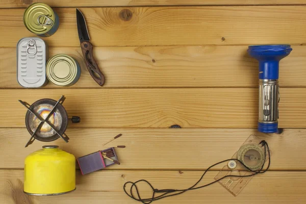 Preparing for summer camping. Things needed for an epic adventure. Sales of camping equipment. Packaging equipment for camping. Camping equipment on a wooden board. — Φωτογραφία Αρχείου