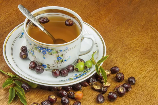 Hot tea with lemon and red arrow in the table. Home treatment for colds and flu. Treating colds using traditional recipes. — Stok fotoğraf