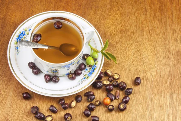 Hot tea with lemon and red arrow in the table. Home treatment for colds and flu. Treating colds using traditional recipes. — Stok fotoğraf