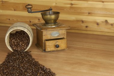 Time for a good aromatic coffee. Coffee on a wooden table. Preparing for home drinking coffee. Freshly roasted coffee beans for coffee. Rest at home for coffee.