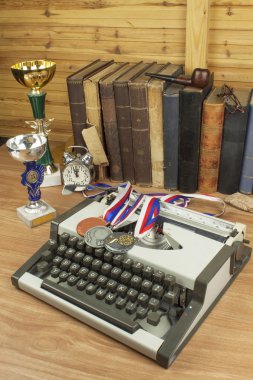 Story sport. Sports journalist writes a story of winners. The story of sports victories. Paper on sport, victory and defeat. ravel typewriter on the desk of the writer. The writer writes a novel.