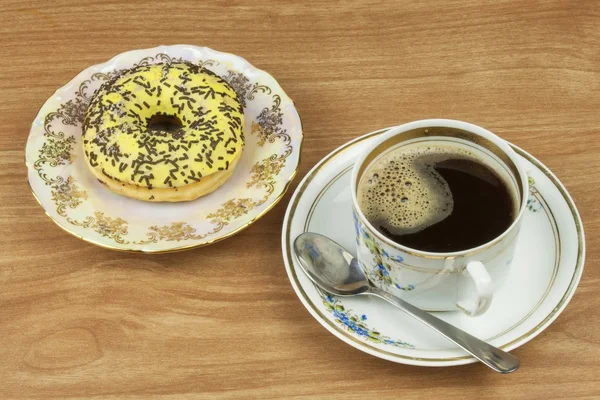 Sweet donut with coffee. Sweet treat with coffee. Donut as quick homemade treats. Junk food diets enemy. A symbol of junk food and obesity, donut for a snack. — Stock Photo, Image