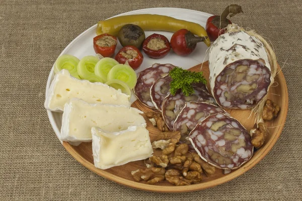 Delicious specialty food, salami with walnuts. Refreshments for important guests. Traditional specialty food. Preparation of home entertainment. — Stock Photo, Image