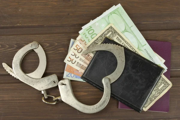 Traffickers international crime. Illegal crossing of the state border. Smuggling for money. Illegal immigrants. Paying smugglers for crossing the border. Real money and fake documents on the table. — Stock Photo, Image