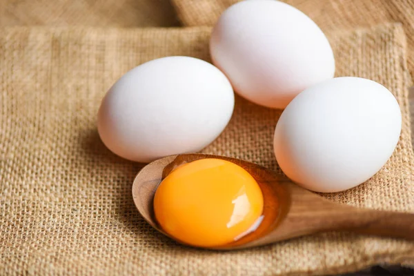 Fresh broken egg yolk, duck eggs white collect from farm products natural in a sack healthy eating concept