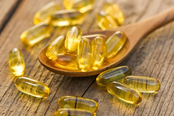 Fish Oil Capsules Omega Vitamin Spoon Wooden Background Healthy Diet — Stock Photo, Image