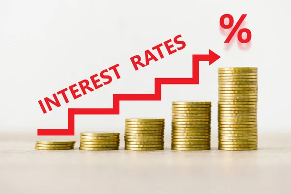 Interest rate financial and mortgage rates concept, stack of coin showing percentage increase graph interest rates rise