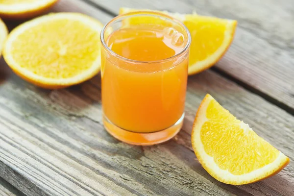 Healthy fruits and orange slice, Fresh orange juice in the glass with orange fruit on wooden background