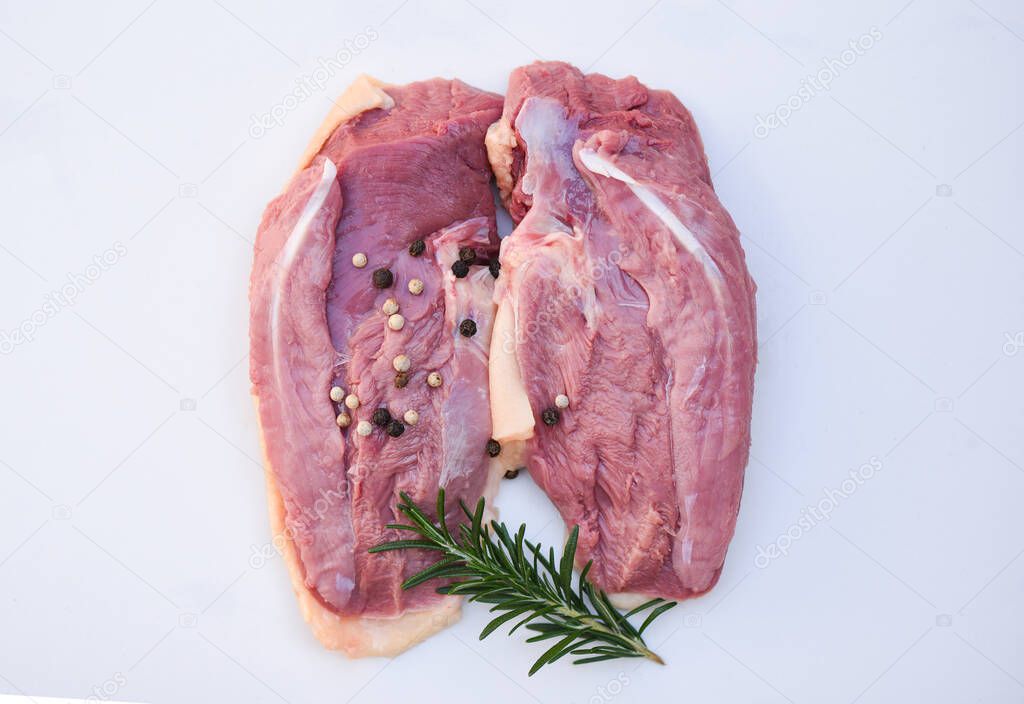 Raw duck breast with herb spices on white gray background, Fresh duck meat for food