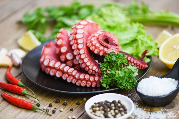 cooked squid salad chili sauce seafood cuttlefish dinner restaurant, Boiled octopus tentacles, Octopus food on wooden background