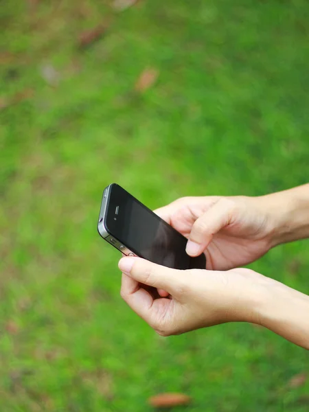 Smart phone in hand Royalty Free Stock Photos