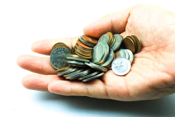 Moedas na mão isoladas em branco — Fotografia de Stock