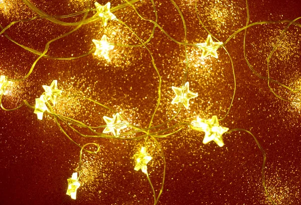Christmas Festive Garlands Shape Star Glowing Festive Bokeh Golden Background — Stock Photo, Image