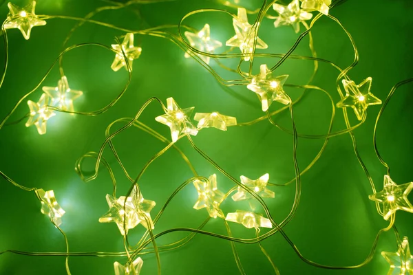Christmas Festive Garlands Shape Star Glowing Festive Golden Bokeh Green — Stock Photo, Image