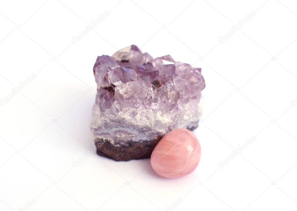 Crystals of amethyst and rose quartz. Gems on a white background. Magic stones. 
