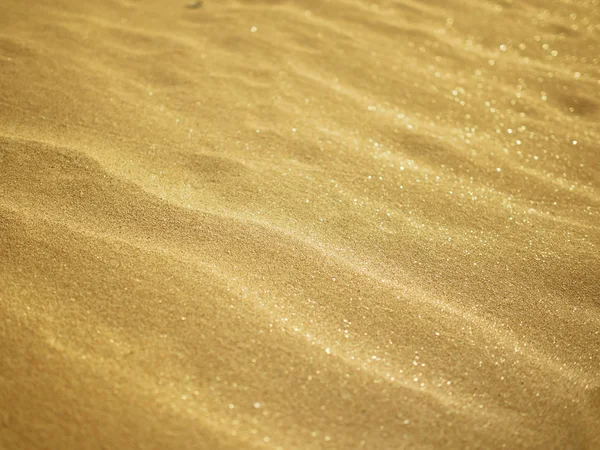 Aard van de kunst op het zand oppervlak door de wind klap. — Stockfoto