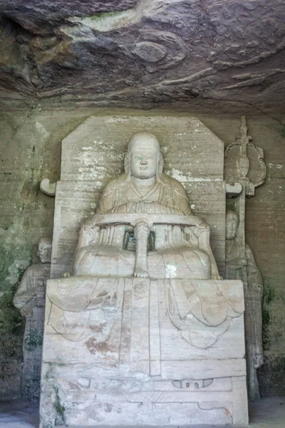 A stone monk in meditation