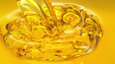 Altın Yağ Sıvısı 'nın 1600 metrede Süper Yavaş Çekimi. Yüksek Hız Sinema Kamerası, 4K.