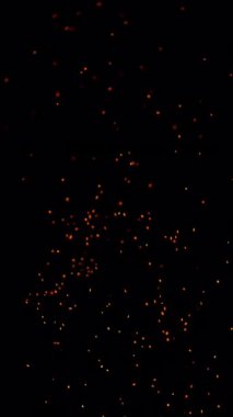 Gerçek Ateşin Süper Yavaş Çekimi Kara Arkaplan 'da izole edilmiş kıvılcımlar. Yüksek Hız Sinema Kamerası, 4K.