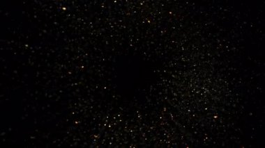 Siyah 1000fps 'te izole edilmiş, Altın Parıltılara doğru dönen Süper Yavaş Film Çekimi. Yüksek Hız Sinema Kamerası, 4K.