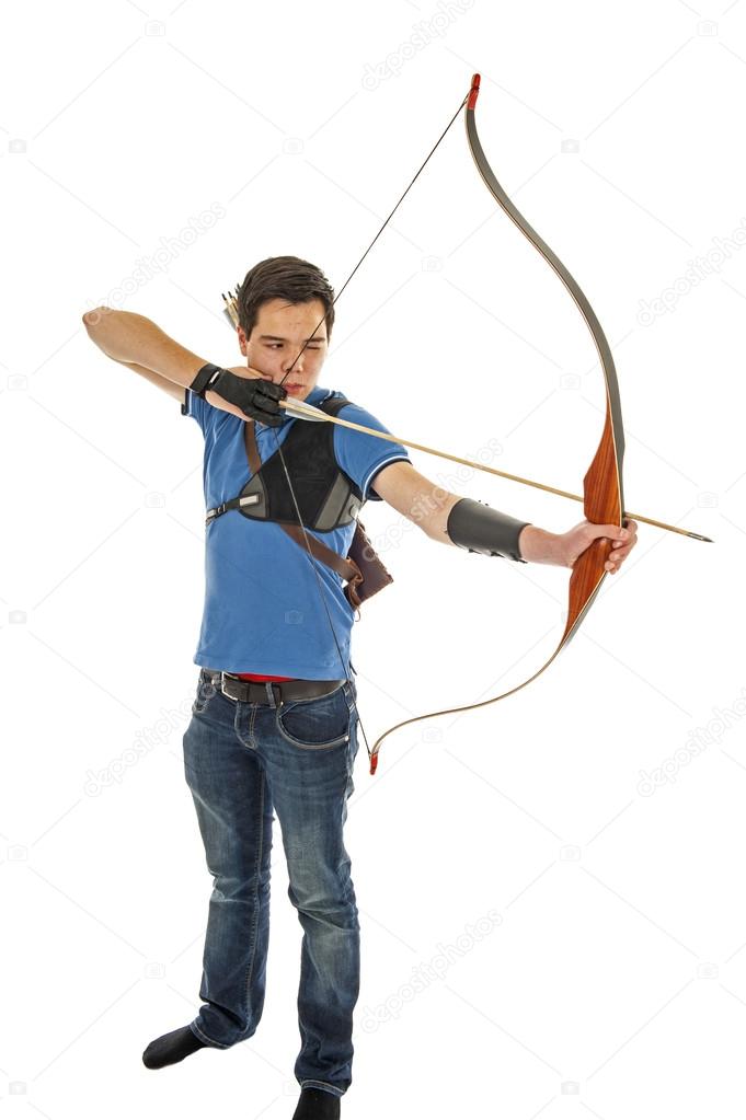 Boy shooting with bow and arrow