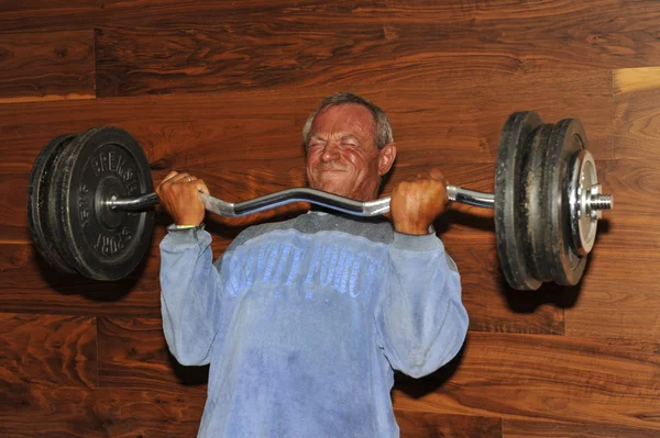 Contestant Uwe Abend lifting his National Record cheating curl — Stock Photo, Image