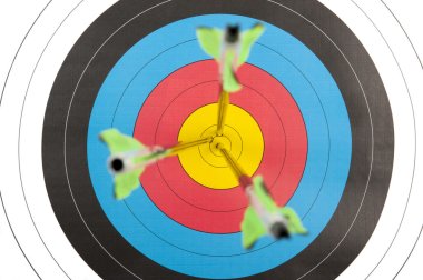 Archery target with arrows in short dept of field clipart