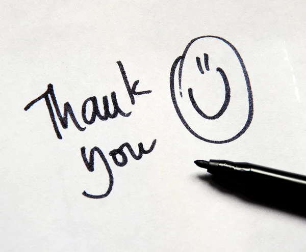 Thank you note with smile and pen — Stock Photo, Image