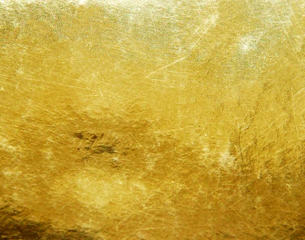 Goldene, zerkratzte Oberfläche — Stockfoto