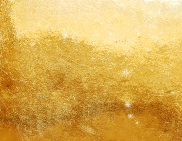 Goldene, zerkratzte Oberfläche — Stockfoto