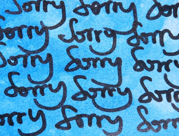 Words sorry on blue background