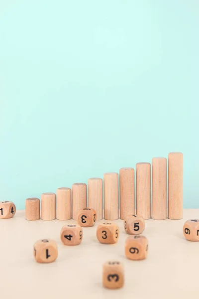 Wooden blocks as increasing graph bar. Dice stack on white table. Concept for business risk, chance, or growth. — Stock Photo, Image