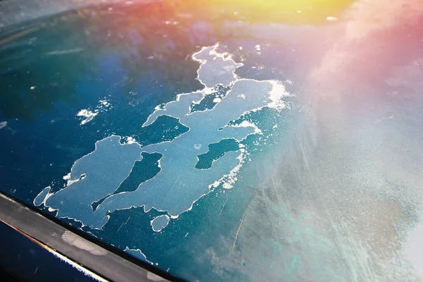 Burnout of car Polish in the sun. Cracked and peeling varnish and paint on the car