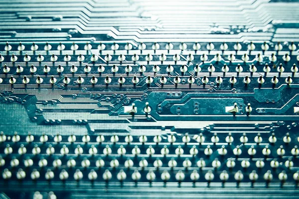 Blue electronic mother board circuit close up macro background
