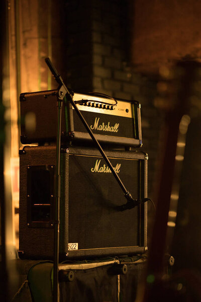 Almaty, Qazaqstan - February, 15, 2020: Marshall 100W half stack tube amp head with cabinet, guitar amp on the stage