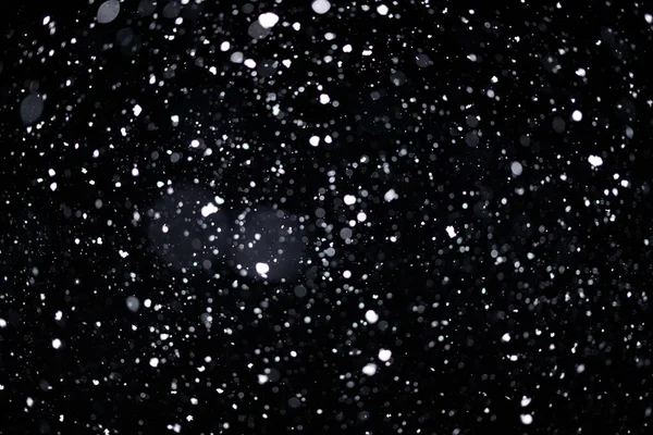 Real falling snow on black background for blending modes in ps. Ver 06 - many snowflakes in blur.