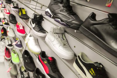 A shoe stand in a sports shoe store. Various collections of sports shop. Top side view. Selective soft focus
