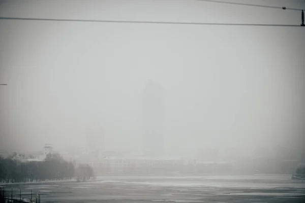 Snowy city with poor visibility, snowstorm on the street.