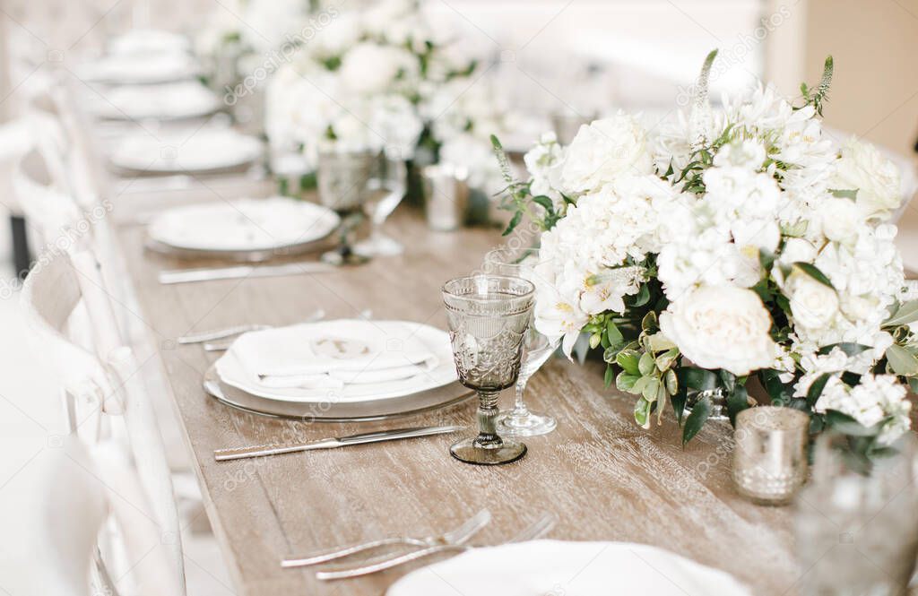 stylish and unusual wedding table and loft decor with flowers