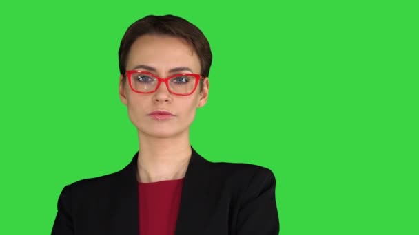 Beautiful woman with short hair in red glasses on a Green Screen, Chroma Key. — Stock Video