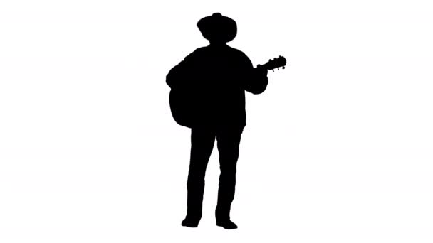 Silhouette Vaquero con guitarra acústica cantando una canción. — Vídeo de stock