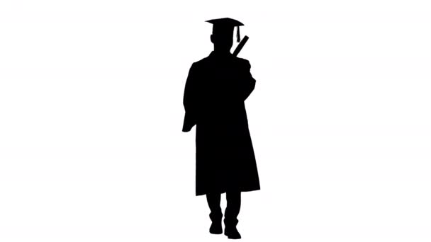 Estudiante graduado caminando y tirando su sombrero, Alpha Channel — Vídeo de stock