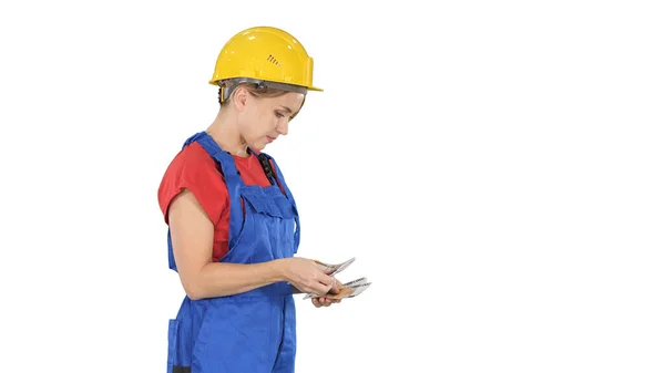 Young woman engineer or architect holding banknotes euros salary — Stock Photo, Image