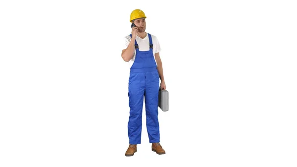 İnşaat işçisi beyaz arkaplanda telefonla konuşuyor.. — Stok fotoğraf