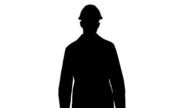 Siluet Arap mühendis miğfer ve beyaz bornoz ileri yürüyor.