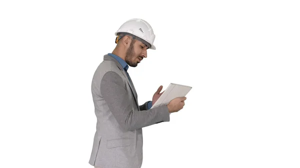 The hipster engineer making video call with tablet showing result of his work on white background. — Stock Photo, Image