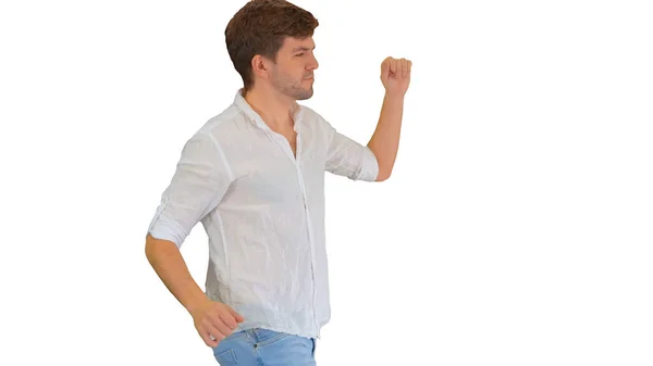 Veselý mladý muž v ležérní šaty tančí šťastně, zatímco walki — Stock fotografie