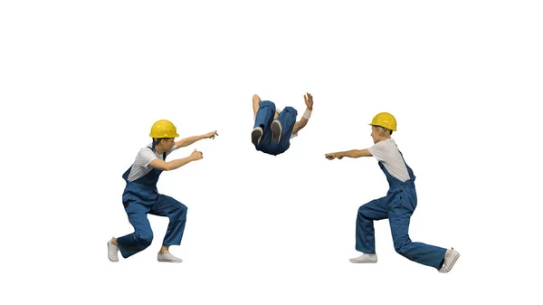 Three young construction workers in hard hats synch dancing look — Stock Photo, Image