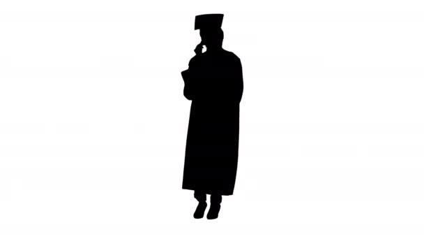 African American female student in graduation robe talking on the phone, Alpha Channel